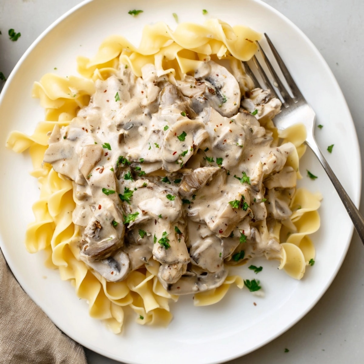 Homemade Creamy Mushroom Stroganoff recipe: a comforting vegetarian dish with earthy aromatics and savory sauce.