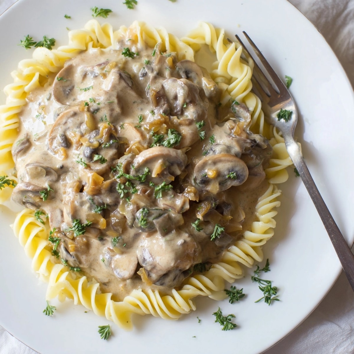 Creamy Mushroom Stroganoff, a hearty and flavorful dinner; capture tender mushrooms in every creamy, dreamy bite.