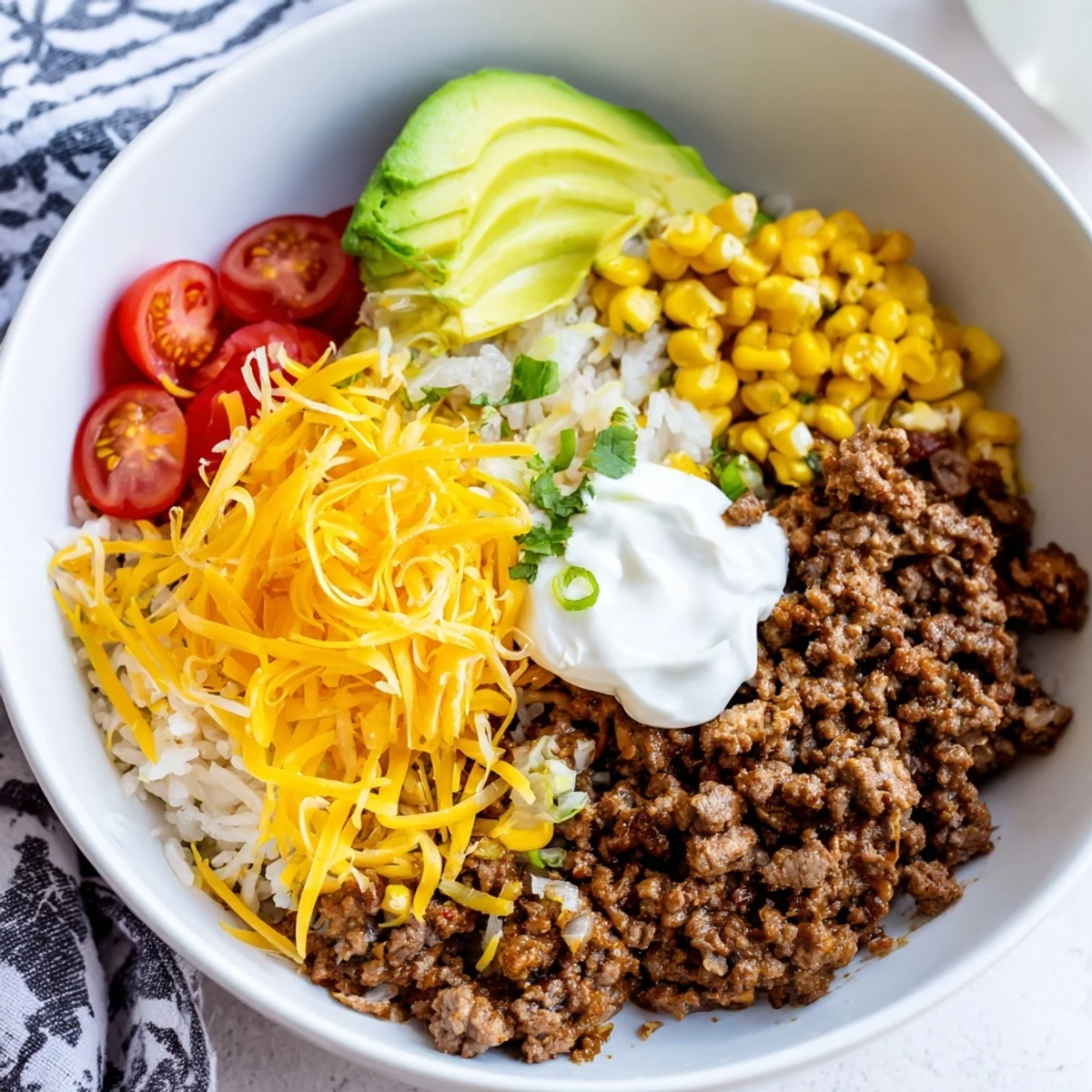 Fluffy white rice tossed with fresh cilantro, lime zest, and juice, ready for spooning into vibrant Beef Burrito Bowls.