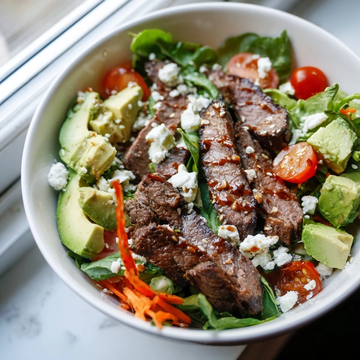 Tender marinated beef slices and colorful vegetables shine in this vibrant Beef Salad Bowl recipe.