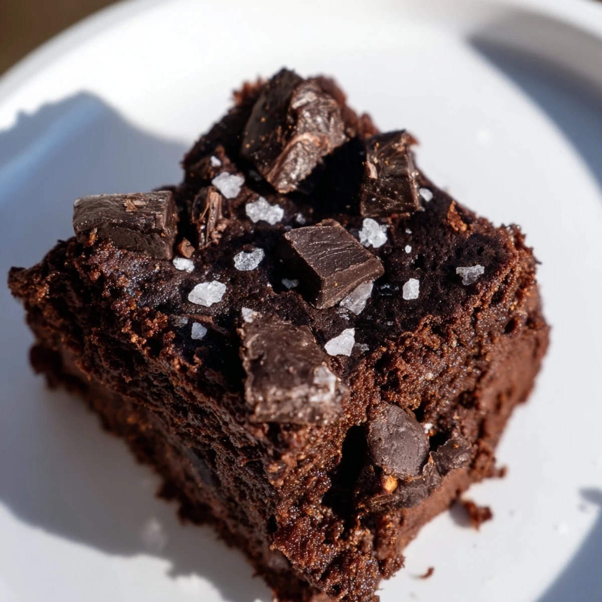 Freshly baked Gluten-Free Almond Flour Brownies with Sea Salt sliced neatly, showcasing a dense and moist crumb texture.
