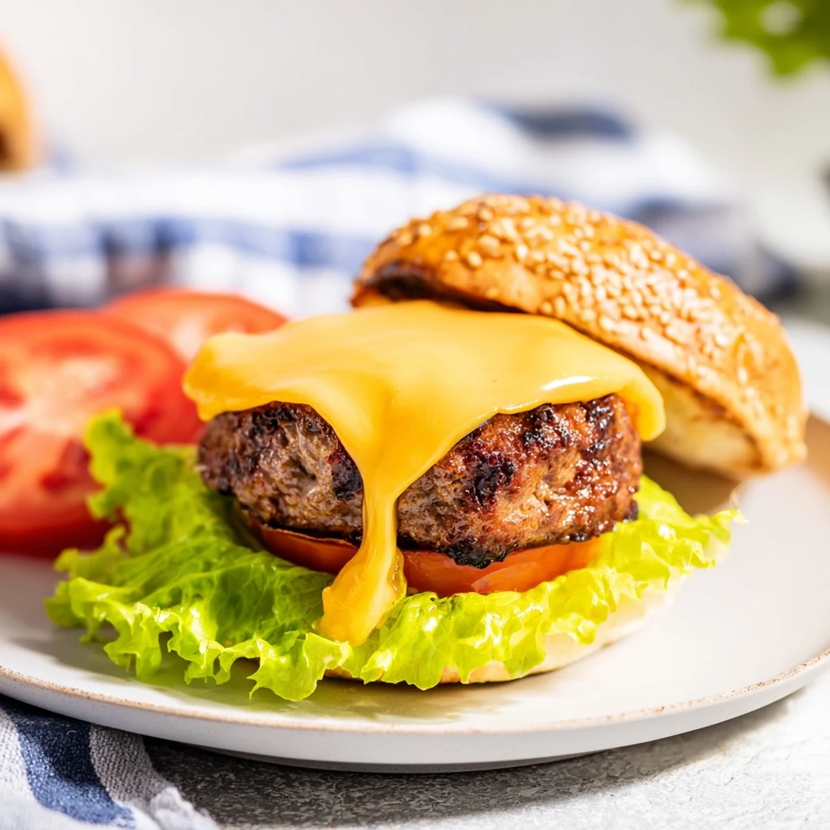 Juicy homemade hamburger patties air fried to perfection with sliced tomato and pickles