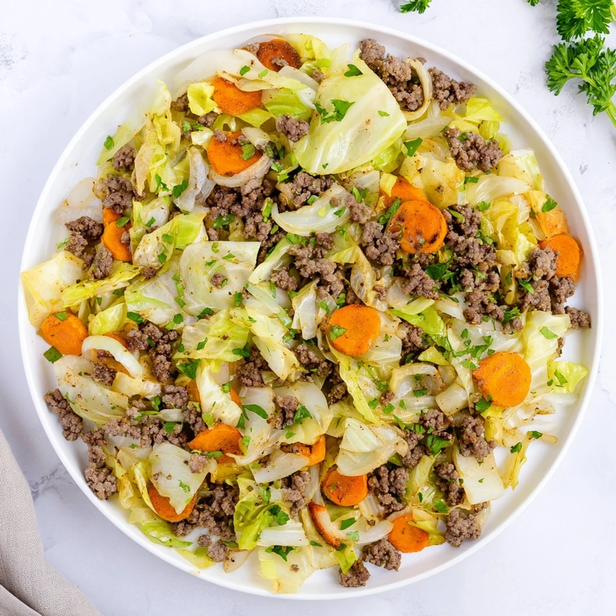 Tender Savory Irish ground beef and cabbage mixture steaming in a skillet ready to serve