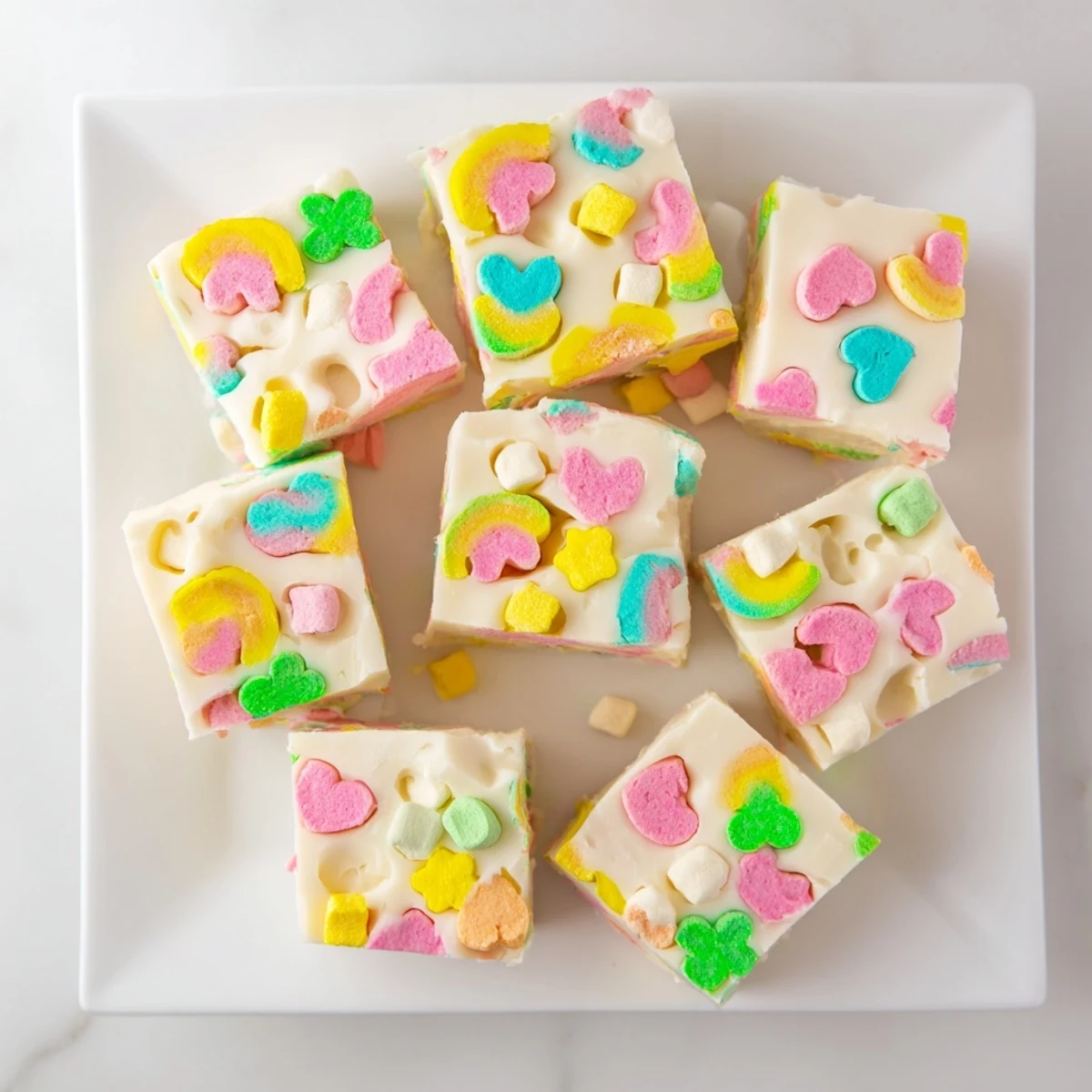 Thick white chocolate fudge swirled with vibrant Lucky Charms marshmallow treats