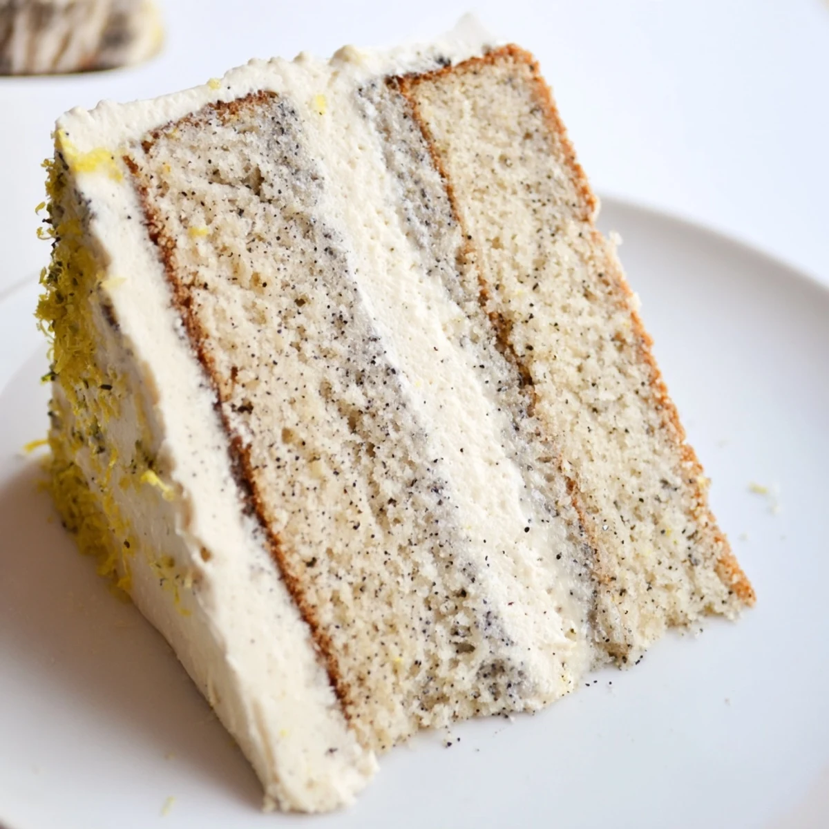 London Fog cake with bergamot-scented sponge stacked between silky buttercream and decorated with delicate edible flowers