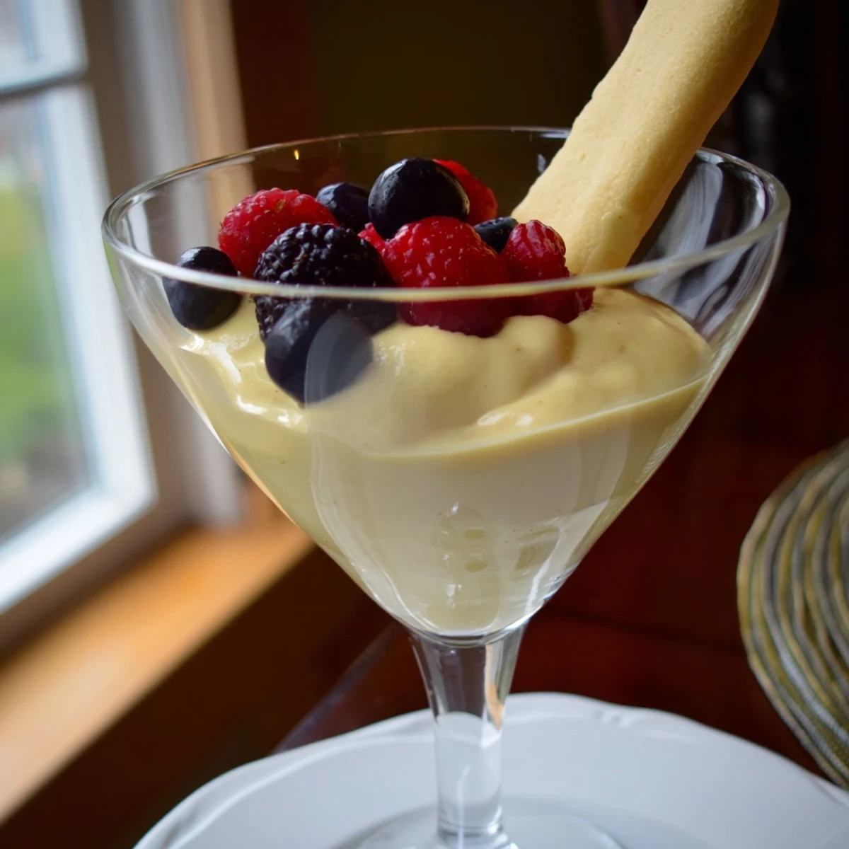 Silky smooth zabaglione dessert whipped to fluffy perfection over a double boiler
