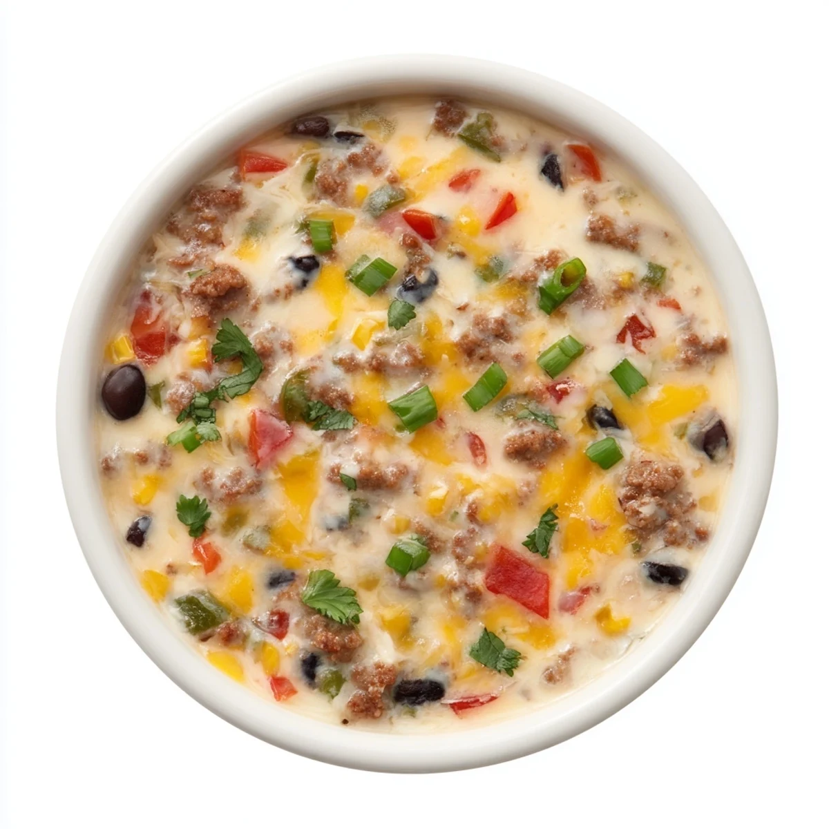 Creamy Spicy Cowboy Queso Dip bubbling in a skillet with colorful peppers, chorizo, and melted cheese topping