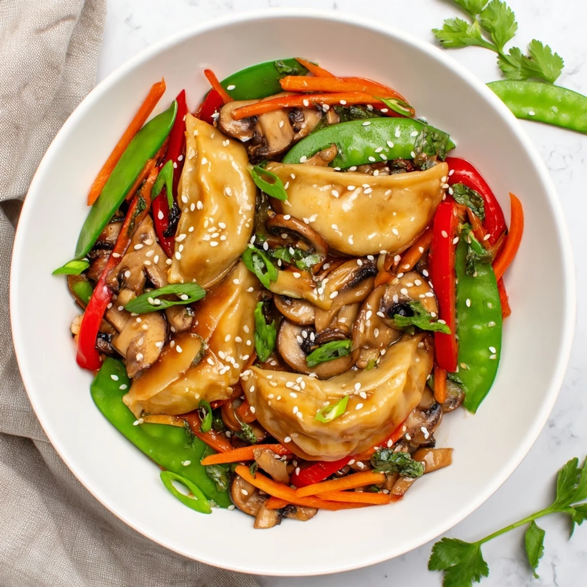 Vibrant potsticker stir fry with snap peas and peppers in glossy sauce