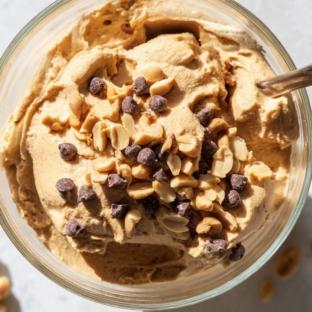 Creamy peanut butter and Cool Whip mousse topped with chocolate shavings in glass cups