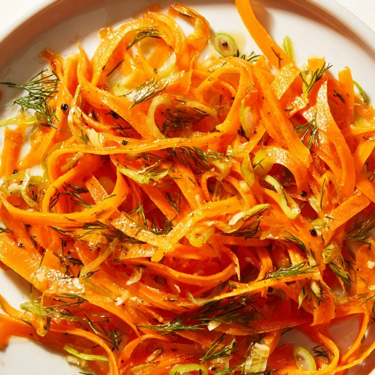 Tender julienned carrots tossed in bright lemon and fresh dill marinade