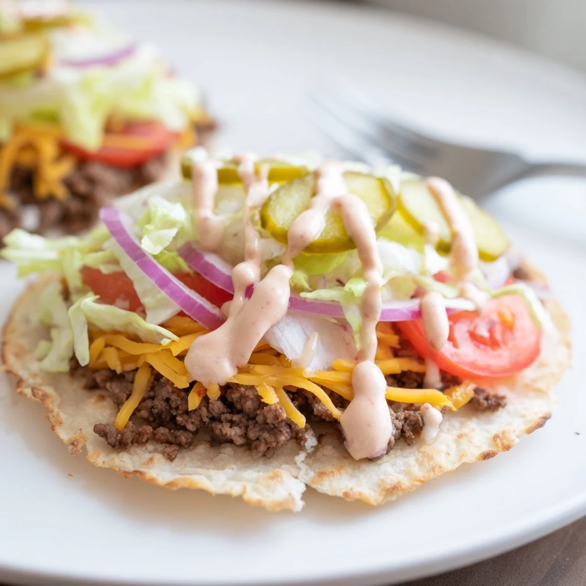 Golden crispy smash burger tacos loaded with melted cheddar and fresh toppings