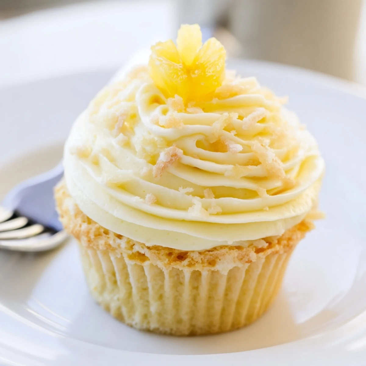 Cooling rack of Dole Whip Cupcakes Recipe showing golden crumb and creamy frosting