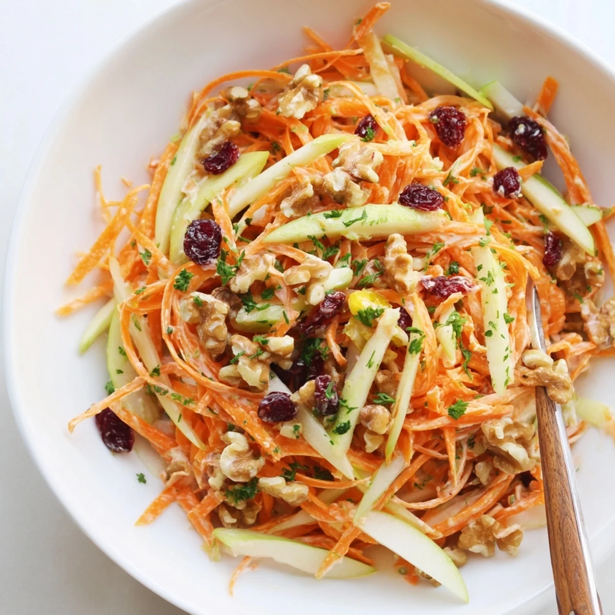 Crunchy Apple Carrot Salad With Creamy Citrus Dressing served chilled with zesty orange aroma