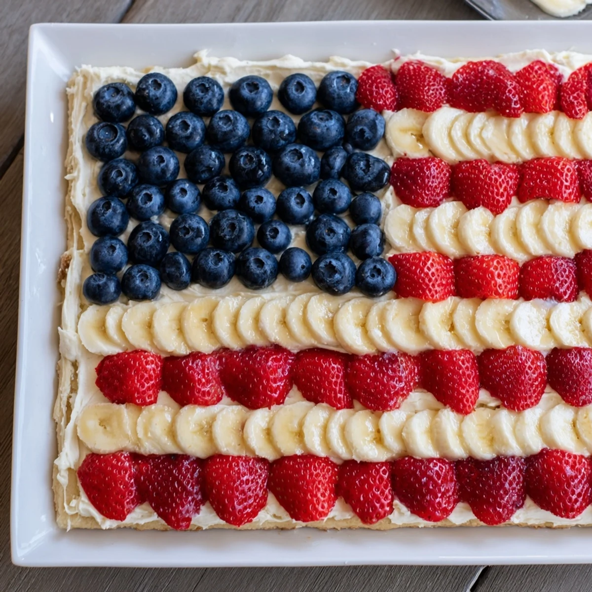 American Flag Fruit Pizza on a chilled cookie crust, juicy berries glistening