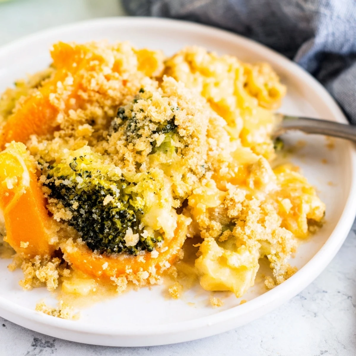 Cheese Bake Broccoli Carrots served warm as vegetarian main next to crusty bread