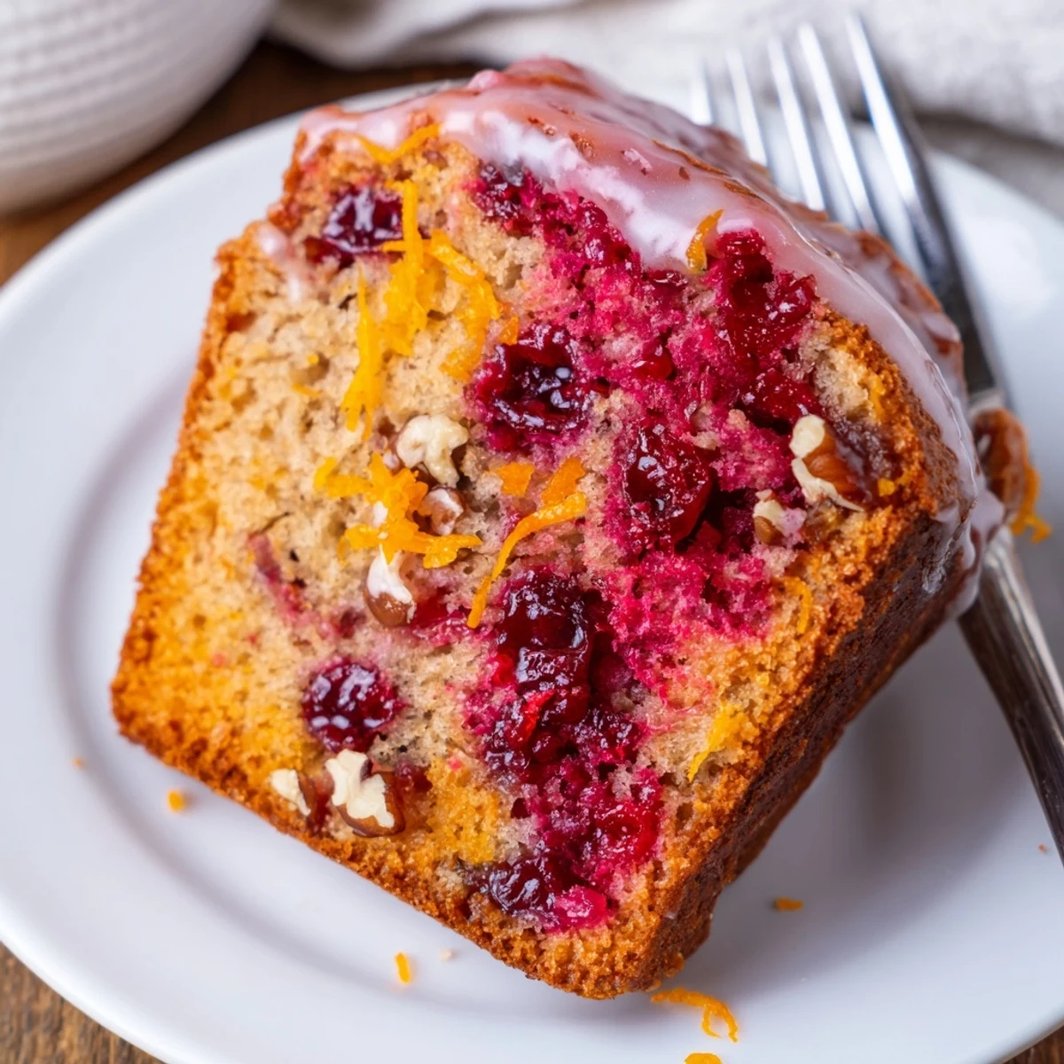 Fresh Cranberry Orange Bread loaf studded with tart berries, orange zest glinting